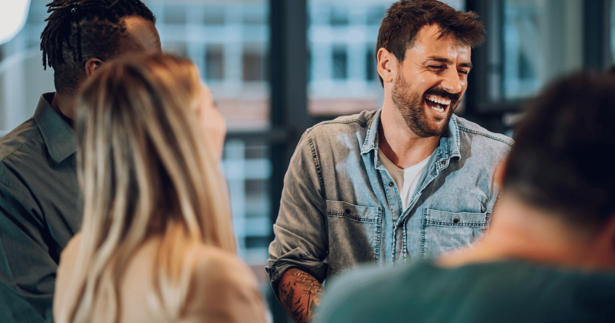 coworkers laugh during break from work