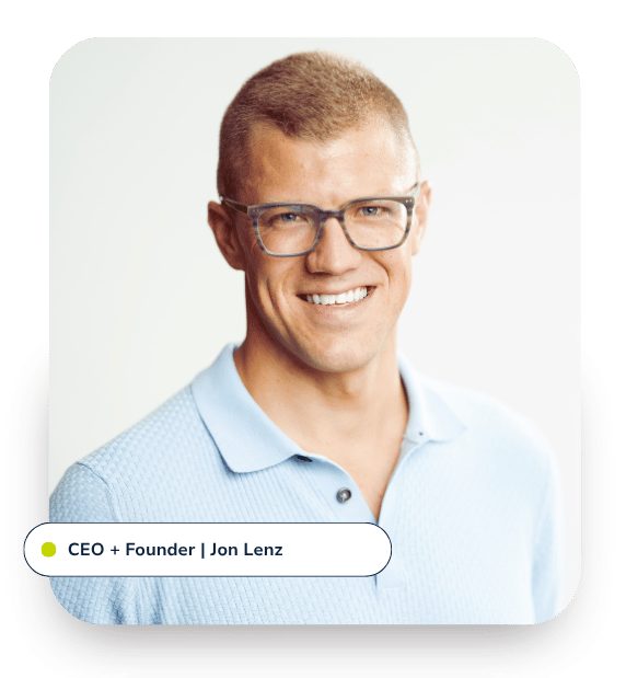 headshot of CEO in a blue shirt with glasses