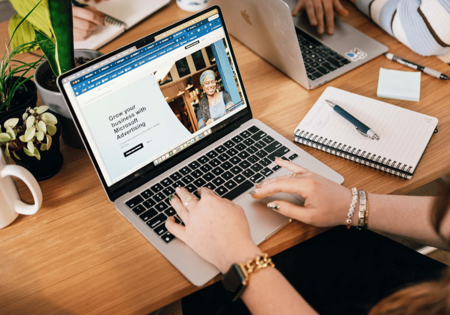 woman visiting the microsoft ads website on laptop