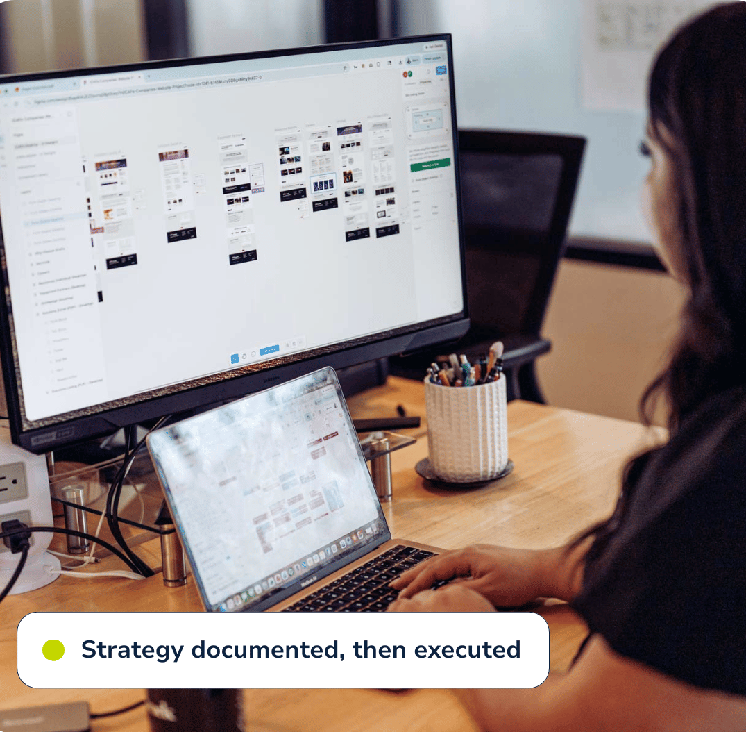 woman looks at ui designs on desktop computer and a calendar on a laptop